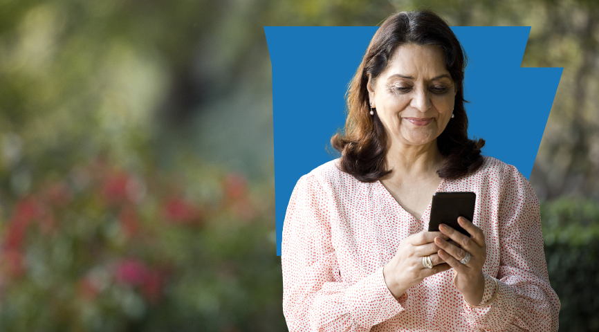 Woman sitting outside using her mobile phone Woman sitting outside using her mobile phone