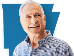 Man smiling and looking up to the right inside the shape of arkansas