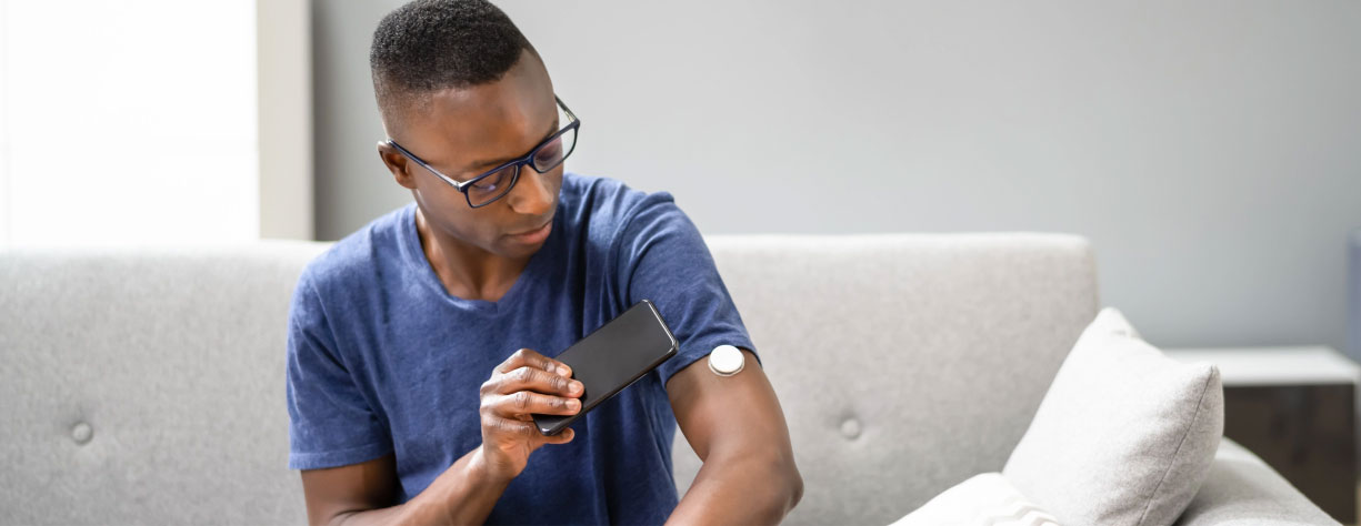 banner-diabetes-care Man checking his blood sugar