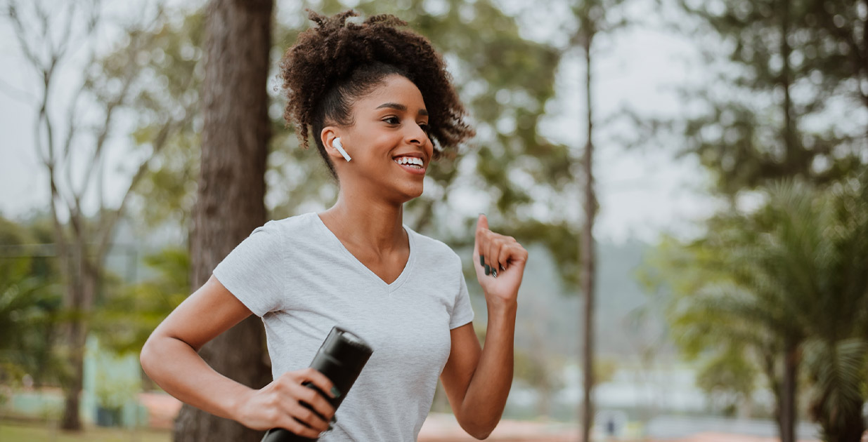 Woman smiling while on a run