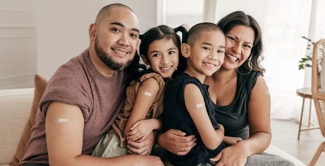 Family showing that they all got vaccinated