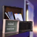 Desk with a sign that says mind over matter