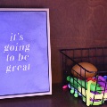 A box of fidget toys and a sign saying it's going to be great
