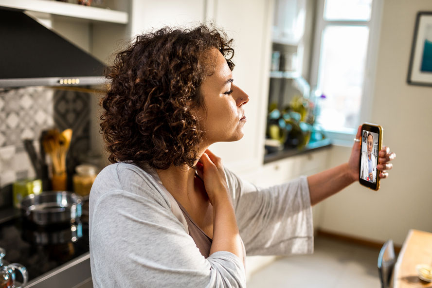 Woman talking to a doctor for a Virtual Health appointment Woman talking to a doctor for a Virtual Health appointment