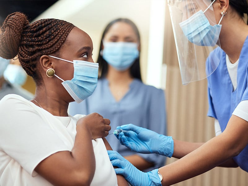 Person receiving an immunization.