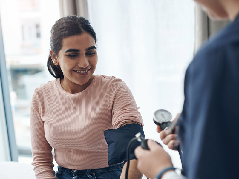 mensandwomens Woman getting her blood pressure taken