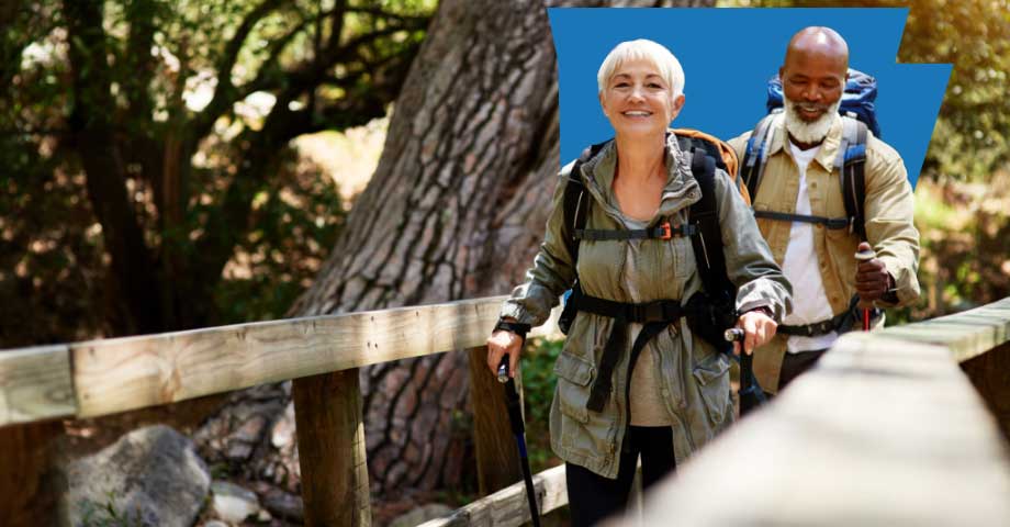 medicare-banner-rewards Woman and man hiking